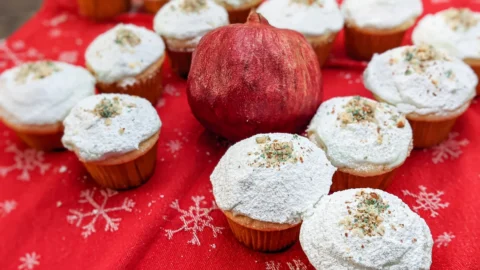 a lineup of our vasilopita cupcakes in a 22 formation.