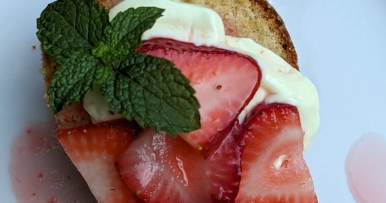 Our pound cake plated with fresh strawberries & yogurt.