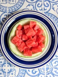Watermelon cubes inside a hollowed watermelon