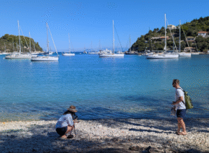 The travelers finding gems at the beach in Paxos. 